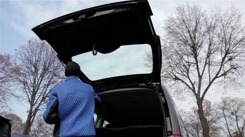 Man  car trunk Stock Footage 58235415