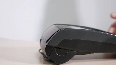 Man with card is using the terminal for payment Stock Footage 107177787