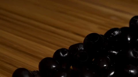 A man carefully cuts olives. Stock Footage 104657456