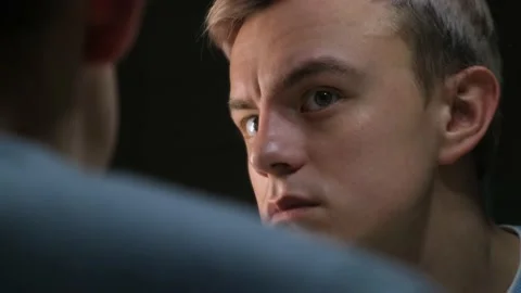 Man carefully looking at himself in the mirror, close-up. Self-esteem concept Stock Footage 231574638