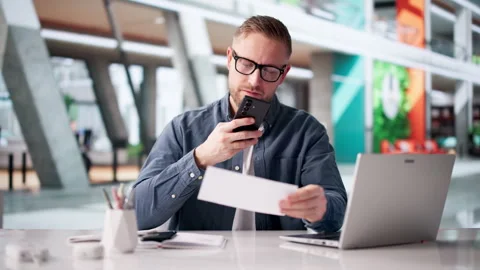 Man Carefully Scans Payroll Cheques Stock Footage 331151616