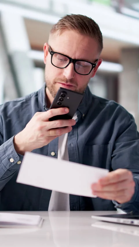 Man Carefully Scans Payroll Cheques Stock Footage 331152866
