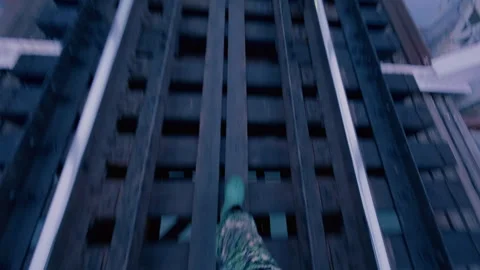 A man carefully walks between the rails on a railway bridge. Stock Footage 320386480
