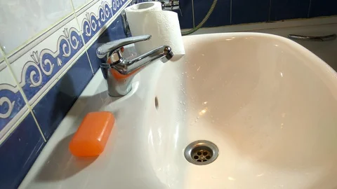 A man carefully washes his hands with soap in the bathroom Stock-Footage 127758404