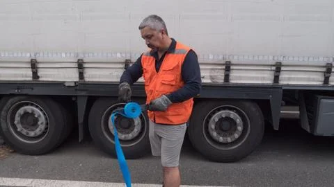 Man with cargo strap. Stock Photos
