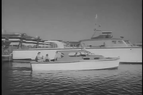 Man of Caribbean air command team do fishing activity, relaxing on boat - 1956 Video stock 99086523