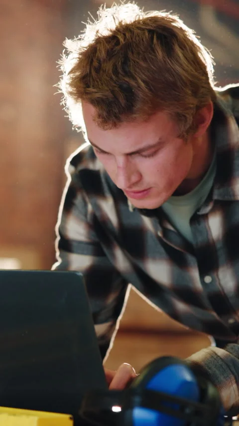 Man, carpenter and typing with laptop in workshop for lumber project or shipping Stock Footage 343816638