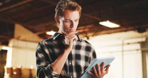Man, carpenter or thinking with tablet in warehouse for wood production, storage Stock Photos
