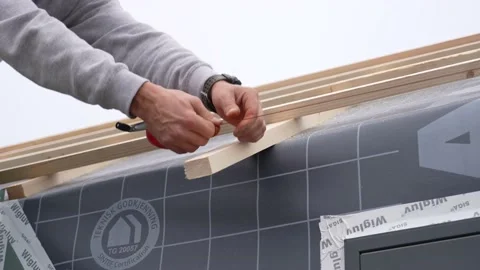 Man carpenter using a chalk string to measure Stock Footage 235790715