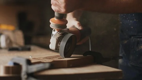A man carpenter is working with wood using circular saw machine Stock Footage 89306531