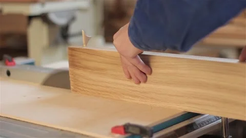 Man carpenter in workshop working with hardwood wearing blue uniform indoors  스톡 동영상 88103619