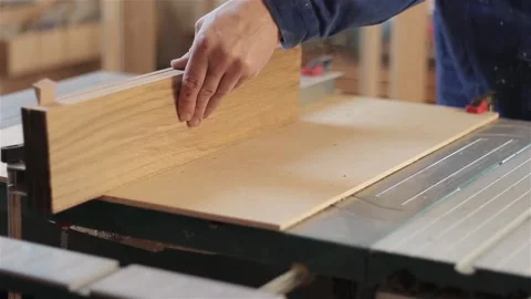 Man carpenter in workshop working with hardwood wearing blue uniform indoors  스톡 동영상 88154698
