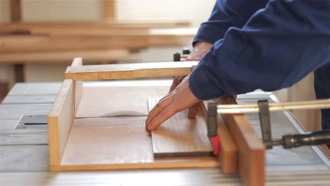 Man carpenter in workshop working with hardwood wearing blue uniform indoors  스톡 동영상 88165725