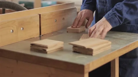 Man carpenter in workshop working with hardwood wearing blue uniform indoors  스톡 동영상 88313021