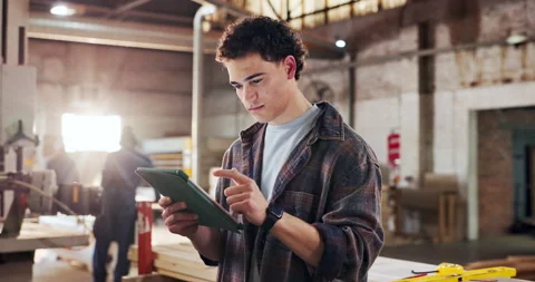 Man, carpentry and tablet in factory with scroll, manufacturing and check online Stock Footage 340002332