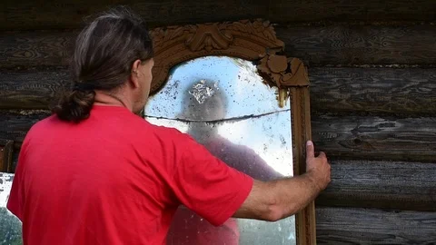 Man carries a large mirror Stock Footage 117112214