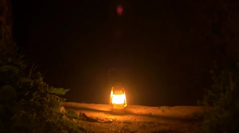 A man carries Old lantern exploring ruins Stock Footage 62216801