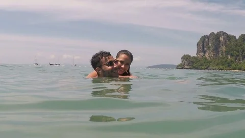 Man Carry Woman Swimming In Sea Water Talking POV, Young Couple Tourists On Stock Footage
