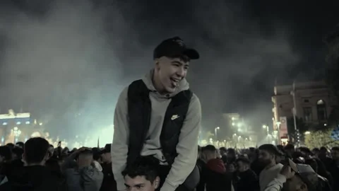 Man carrying another man on his shoulders during, celebration for Atalanta Stock Footage 276179453