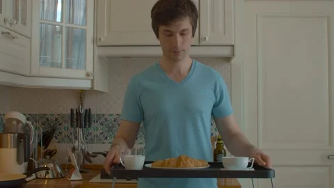 Man carrying breakfast tray Stock Footage 130936883