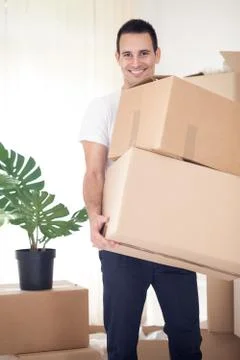 Man carrying cardboard box Stock Photos