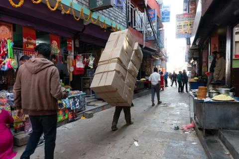 Man Carrying Carton Boxes Stock Photos