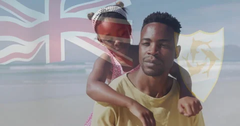Man carrying child at beach, showcasing travel with translucent flag and dolphin Stock Footage 310219731