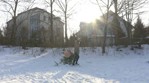 Man Carrying Christmas Tree Stock Footage 71755784