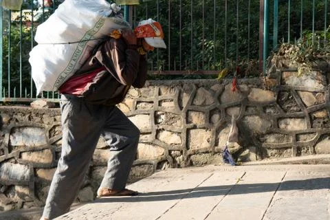 Man Carrying Load Stock Photos