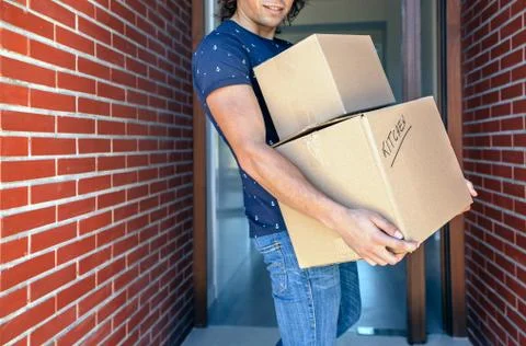 Man carrying moving boxes Stock Photos