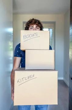 Man carrying moving boxes Stock Photos