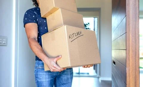 Man carrying moving boxes Stock Photos