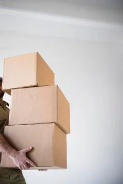 Man carrying stack of boxes Stock Photos