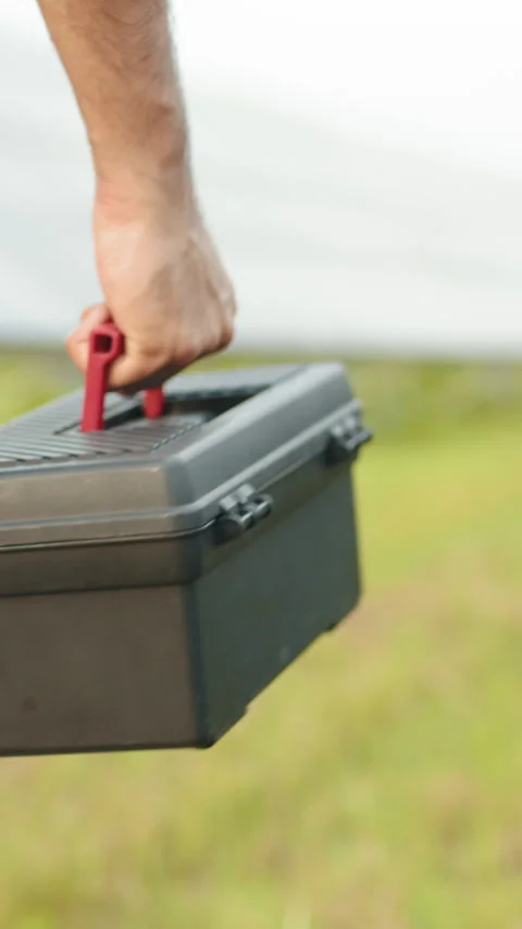 Man Carrying Toolbox Stock Footage 317422877
