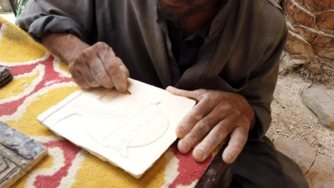 Man Carves Pattern Onto Clay Tablet For Decoration Stock Footage 109388882