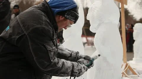 Man  carving ice sculpture Stock Footage