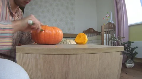 Man carving pumpkin for Helloween Stock Footage 68658638