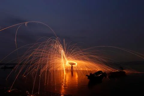 Man cast Fire steel wool Stock Photos