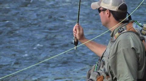 Man Casting And Reeling In Slo-mo Stock Footage 24704714