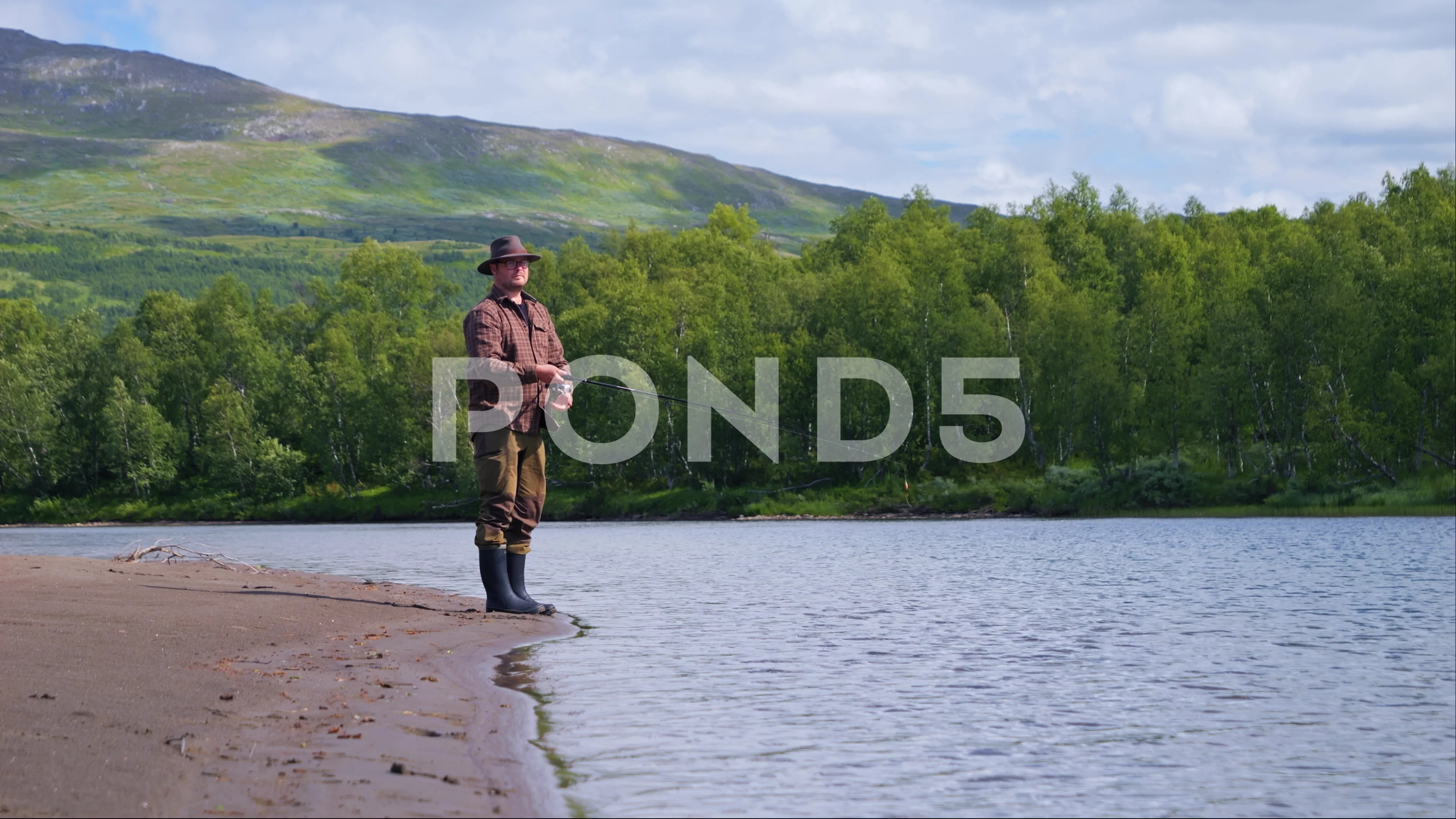 https://images.pond5.com/man-casting-fishing-line-lake-footage-247875987_prevstill.jpeg
