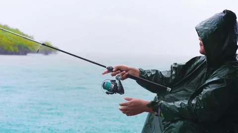 A man casting a line under the line in Slow motion. Peaceful Fishing on a W.. Stock Footage 304094476