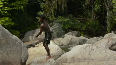 MAN CASTING NET INTO THE RIVER-(HD) Stockbeeldmateriaal 145355911