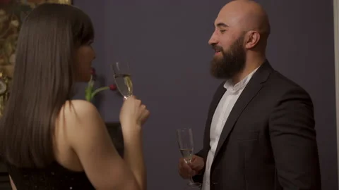 Man casts his amorous glance at a woman in a chic black dress 스톡 동영상 147605064