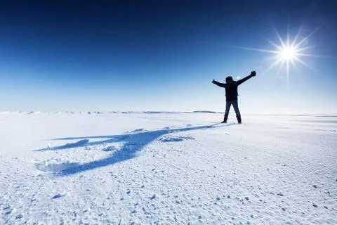Man casts a shadow on the snow Foto stock