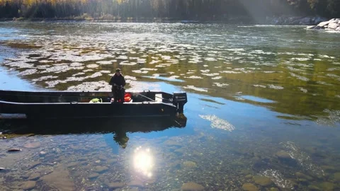 Man casts spinning sunny river mountains autumn Video stock 167613747