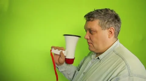 Man in casual clothes shouting into a megaphone Stock Footage 20482049