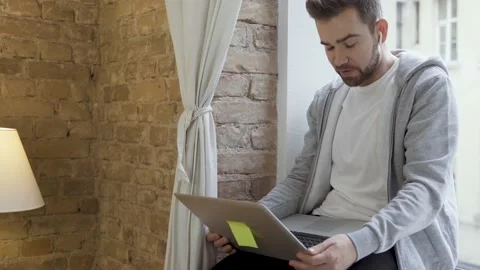 Man in casual clothes using laptop and having video call Vídeo Stock 233432637