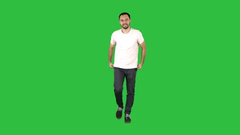 Man in casual walking on a Green Screen, Chroma Key. 動画素材 99409657