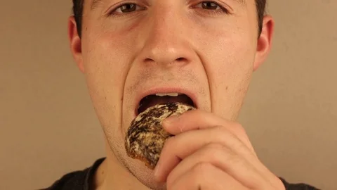 The man casually chews food Video stock 118700187