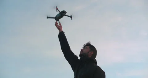 Man catch drone in his hand Stock Footage 258672957